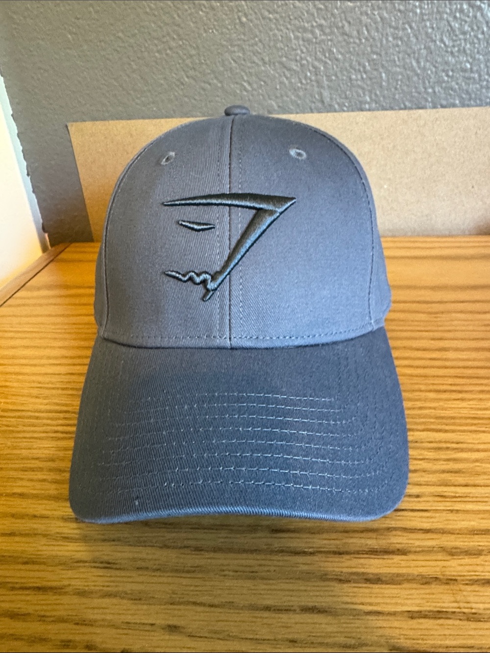New without tags GymShark brand hat with slide strap adjustment.